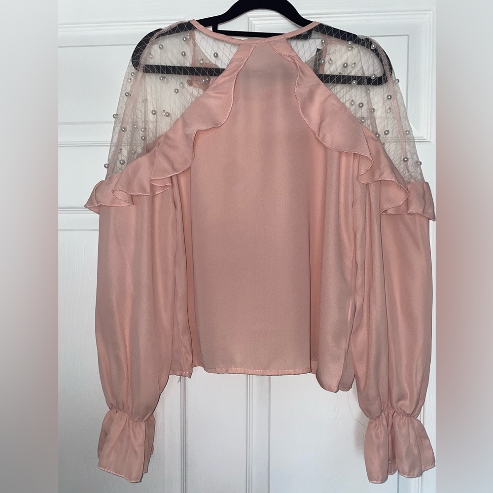 Pink blouse size medium with ruffles in the front and back sheer with beading
